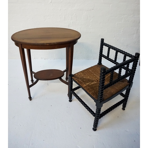 459 - EBONISED BOBBIN TURNED CORNER CHAIR
with a rush seat, standing on bobbin turned supports united by s... 