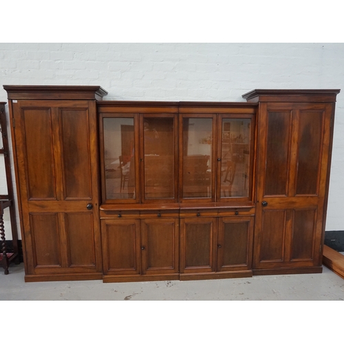 465 - EDWARDIAN MAHOGANY SECTIONAL BOOKCASE
with a pair of outer panelled cupboard doors with moulded tops... 