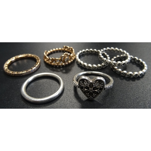 120 - SEVEN PANDORA RINGS
including a rose Princess Tiara, three silver Linked Love, a silver Heart of Win... 