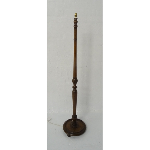 455 - OAK STANDARD LAMP
the shaped turned column with a floral carved section, raised on a circular dished... 