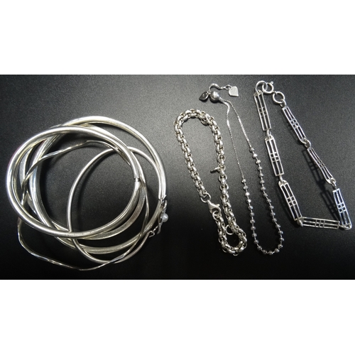 69 - SELECTION OF EIGHT SILVER BANGLES AND BRACELETS
including a Machintosh style bracelet and a wavy ban... 