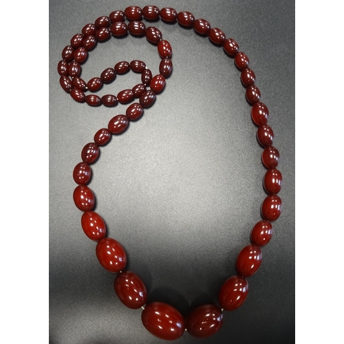 75 - GRADUATED CHERRY AMBER BEAD NECKLACE
approximately 88cm long