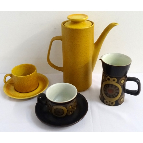 196 - TWO RETRO POTTERY PART COFFEE SERVICES
one a Meakin Maidstone pattern example of burnt yellow ground... 