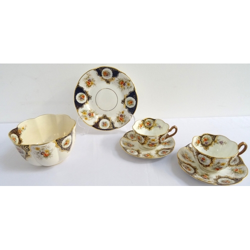 202 - WILLIAM LOWE TEA SERVICE
with floral and gilt decoration, comprising twelve cups, saucers and side p... 