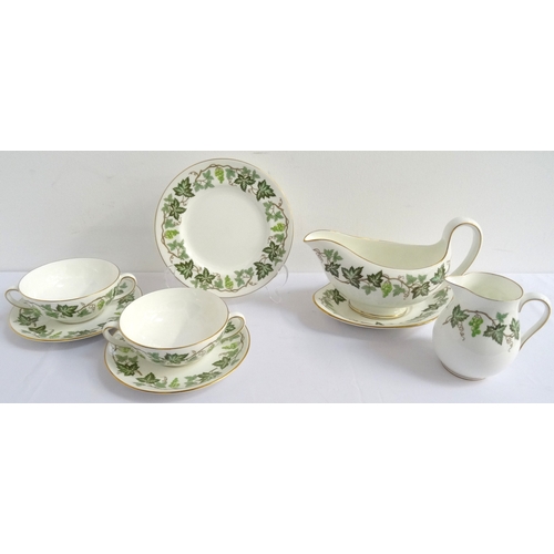 212 - WEDGWOOD PART DINNER SERVICE
with vine decoration on a white ground, comprising six coffee cans and ... 