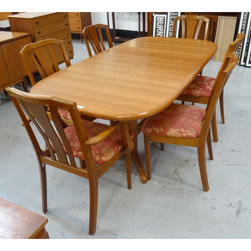 463 - TEAK DINING SUITE
the extending dining table with a pull apart top revealing a fold out leaf, standi... 