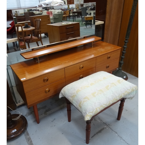 386 - SCHREIBER TEAK DRESSING CHEST
the raised mirror back above a shaped shelf with an arrangement of six... 