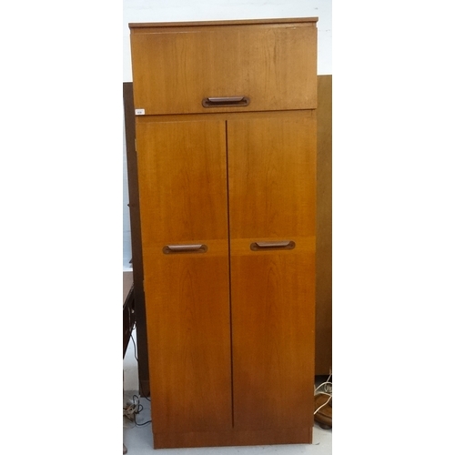 438 - SAKOL TEAK WARDROBE
the moulded square top above a lift up cupboard door with a pair of full length ... 