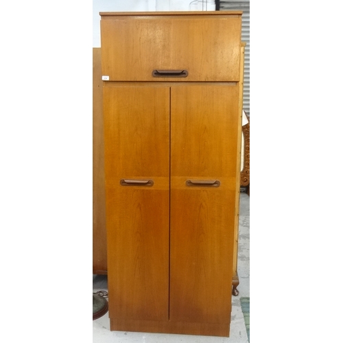 439 - SAKOL TEAK WARDROBE
the moulded square top above a lift up cupboard door with a pair of full length ... 