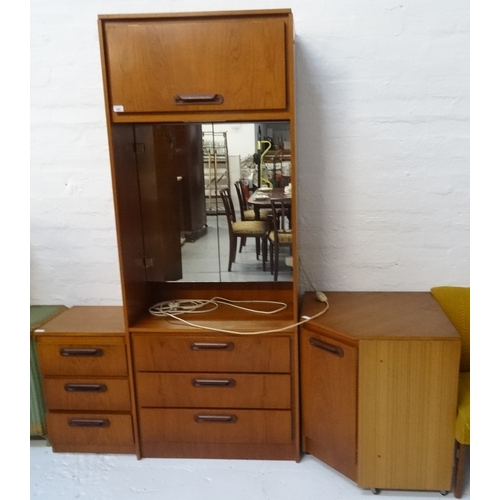 440 - SAKOL TEAK DRESSING CUPBOARD
with a moulded square top above a lift up cupboard door, with a pair of... 