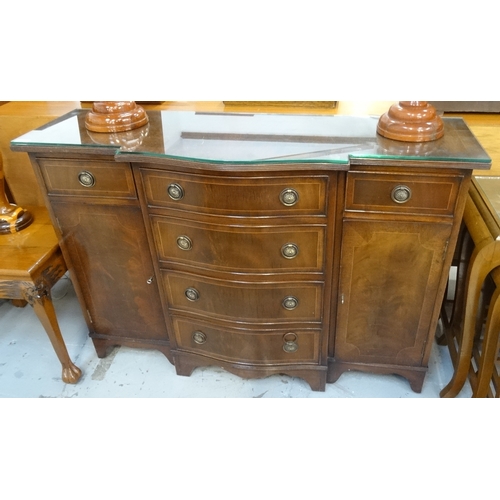 442 - REGENCY STYLE MAHOGANY AND CROSSBANDED BREAKFRONT SIDEBOARD
the moulded top above four central gradu... 