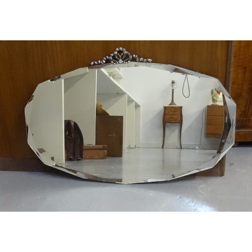 461 - CIRCULAR WALL MIRROR
with a bevelled plate contained in a floral decorated frame, 48cm wide, togethe... 