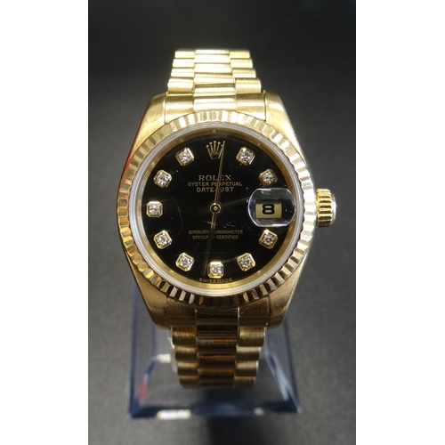 50 - LADY'S EIGHTEEN CARAT GOLD CASED ROLEX OYSTER PERPETUAL DATEJUST WRISTWATCH
the black dial set with ... 