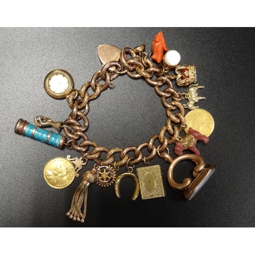 61 - NINE CARAT GOLD CURB LINK CHARM BRACELET
with a good selection of gold and other charms, including a... 