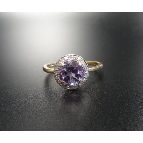 74 - AMETHYST AND DIAMOND CLUSTER RING
the central round brilliant cut amethyst in twenty diamond surroun... 