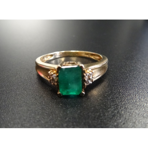 89 - EMERALD AND DIAMOND DRESS RING
the central emerald cut emerald approximately 0.85cts flanked by four... 