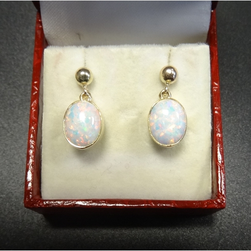 94 - PAIR OF OPAL DROP EARRINGS
the oval cabochon opals in nine carat gold settings