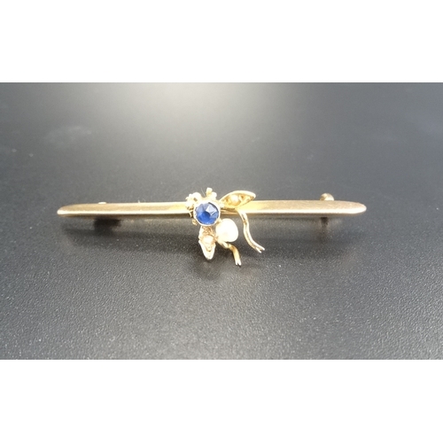 111 - NINE CARAT GOLD BAR BROOCH
with a sapphire and seed pearl set fly to the centre