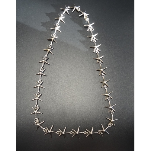 120 - SILVER TIFFANY STYLE NECKLACE - RETURNED
formed of starfish shaped links, 51cm long