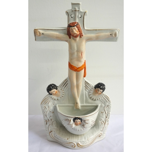 152 - 19th CENTURY STAFFORDSHIRE HOLY WATER FONT
modelled as Christ on the Cross, above an Angel Font base... 