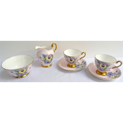 162 - TUSCAN PART TEA SERVICE
with a lilac ground and floral motifs with gilt highlights, comprising tea c... 