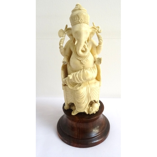 191 - DETAILED IVORY CARVING OF GANESHA
raised on a circular mahogany plinth, 16.5cm high