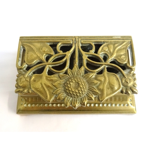 197 - ART NOUVEAU STYLE BRASS STAMP BOX
with a pierced lift up lid decorated with a sunflower and flowing ... 