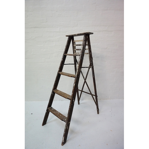 199 - 'A' FRAME WOODEN STEPLADDER
with four shaped steps and a fold out slatted shelf