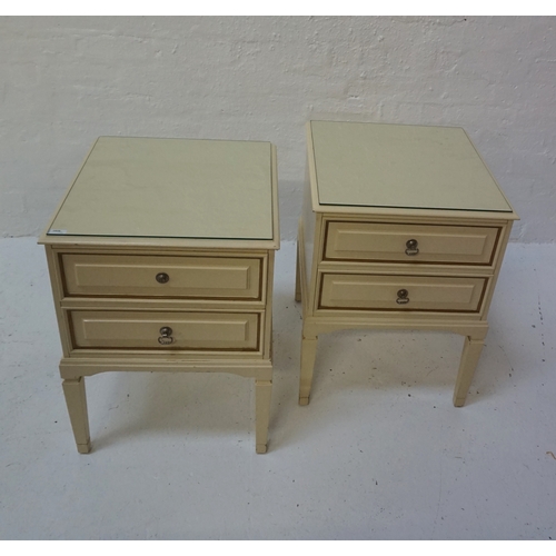 425 - PAIR OF PAINTED MAHOGANY BEDSIDE CABINETS
each with a moulded top with two panelled drawers below, s... 