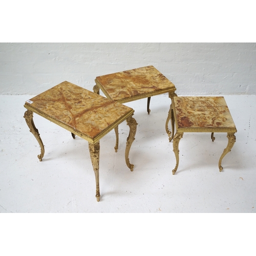 406 - NEST OF THREE MARBLE TOP OCCASIONAL TABLES
raised on decorative gilt metal frames, the largest 44.5c... 