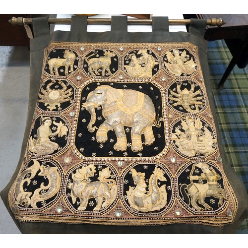 225 - SAUDI ARABIAN EMBROIDERED WALL HANGING
with a central decorative elephant surrounded by the twelve s... 