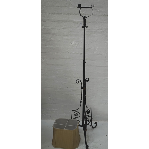 427 - PAINTED WROUGHT IRON ADJUSTABLE LAMP STAND
raised on three scroll supports with applied flower head ... 