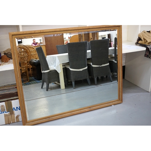 428 - LARGE RECTANGULAR GILT FRAMED MIRROR
with a bevelled plate, 119cm x 151cm