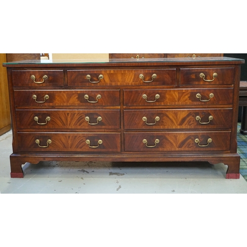 418 - MAHOGANY AND CROSSBANDED CHEST
with canted corners flanking three frieze drawers and two banks of th... 