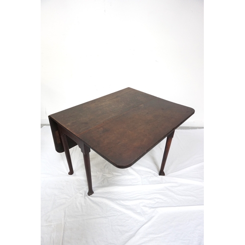 450 - GEORGE III OAK DROP FLAP TABLE
with shaped flaps standing on turned tapering supports with pad feet,... 