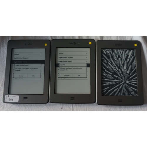 266 - THREE KINDLE 5 TOUCH WIFI DEVICES
serial numbers: B011 1407 1467 3UEP; B011 1408 2223 0EK4 & B011 16... 