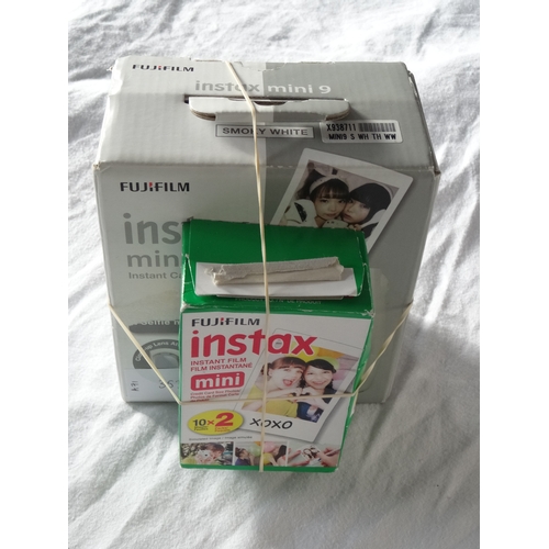 353 - BOXED FUJIFILM INSTAX MINI 9 INSTANT FILM CAMERA
With 2 packs of film.