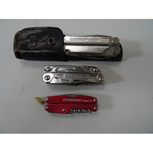 395 - THREE LEATHERMAN MULTI-TOOLS
comprising one Leatherman Wave, with case; one Leather Rev; and one Lea... 