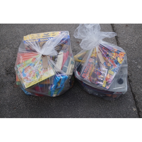 148 - TWO BAGS OF USED AND NEW TOYS
including plaster moulding X-men, jigsaws, Nigel Mansell Tyco, teddy b... 