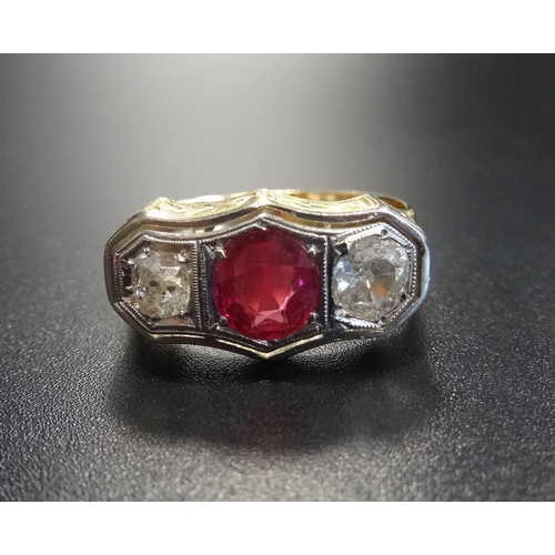 18 - SYNTHETIC RUBY AND DIAMOND THREE STONE RING
the central round cut ruby approximately 1ct flanked by ... 