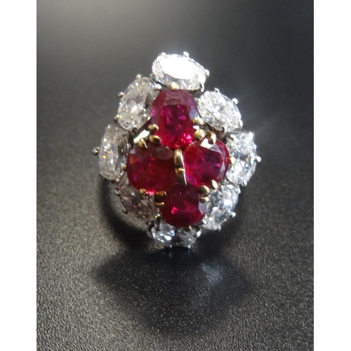 34 - OUTSTANDING RUBY AND DIAMOND CLUSTER RING
the central ruby cluster formed with four oval cut stones ...