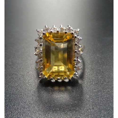 74 - CITRINE AND DIAMOND COCKTAIL RING
the large central emerald cut citrine in twenty-two diamond surrou... 