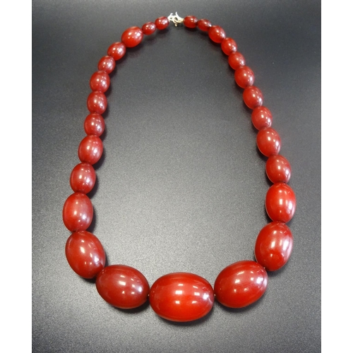 118 - GRADUATED CHERRY AMBER BEAD NECKLACE
approximately 47cm long and 62 grams; together with beads for a... 