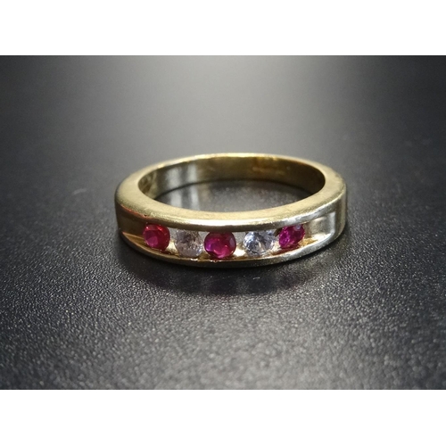 136 - CHANNEL SET RUBY AND CZ FIVE STONE RING
in nine carat gold, ring size N-O  -  RE-OFFERED TIMED AUCTI... 