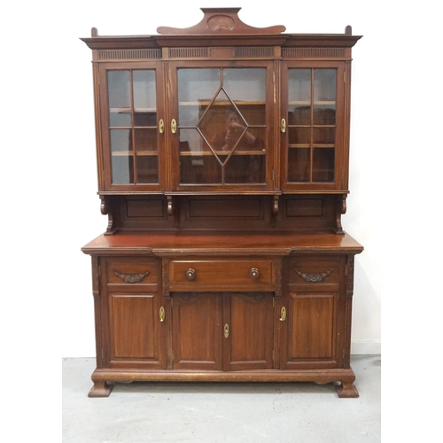 538 - SCOTTISH EDWARDIAN MAHOGANY BREAKFRONT SIDE CABINET
with an arched carved pediment above three astra... 