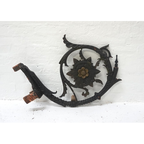 549 - VICTORIAN CAST IRON GAS LAMP BRACKET
of tubular scroll form centered with a flower head and vines, a... 