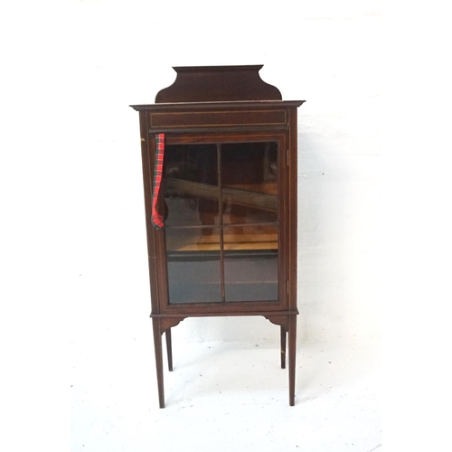 550 - EDWARDIAN MAHOGANY AND INLAID MUSIC CABINET
with a shaped raised back above an inlaid frieze with a ... 