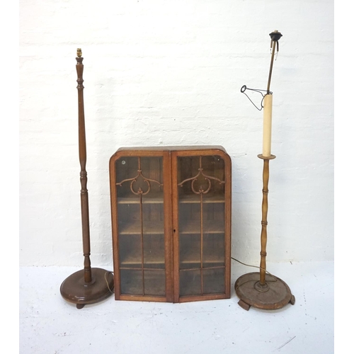 555 - OAK DISPLAY CABINET
with a pair of shaped glazed and beaded doors opening to reveal adjustable shelv... 