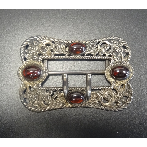 154 - LATE VICTORIAN BELT BUCKLE
with cabochon set stones to the decorative pierced and scrolled buckle, t... 