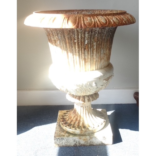 546 - VICTORIAN CAST IRON CAMPANA SHAPED URN
with a fold over rim with moulded decoration above a tapering... 